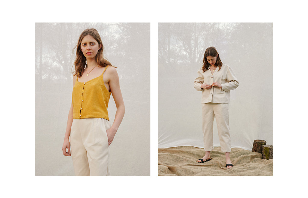 brown-haired-model-wears-ochre-camisole-vest-and-ecru-highwaisted-trousers
