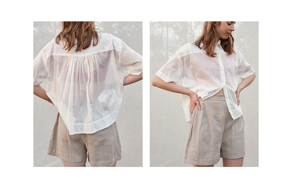 brown-haired-model-wears-translucent-white-shirt-over-red-bra-top-and-grey-linen-shorts